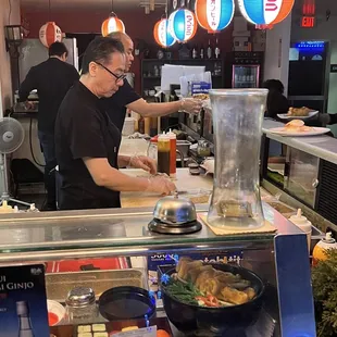 Chefs doing their thing... bar stools