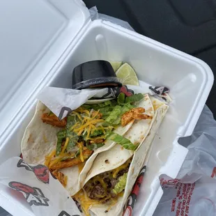 a taco in a styrofoam container