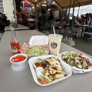 Asada fries, quesadillas, asada and tripa tacos, horchata