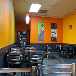 an empty restaurant with tables and chairs