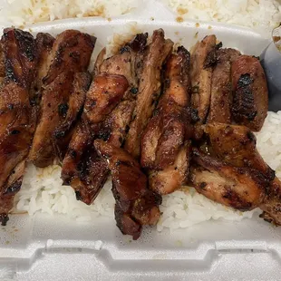 a tray of rice and meat