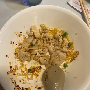 a bowl of food and chopsticks