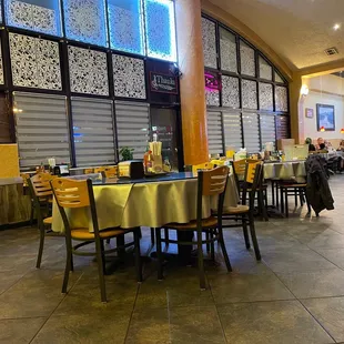 a restaurant with tables and chairs