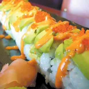 Godzilla Roll (Spicy Tuna roll topped with Avocado, Tobiko, and Spicy Mayo)