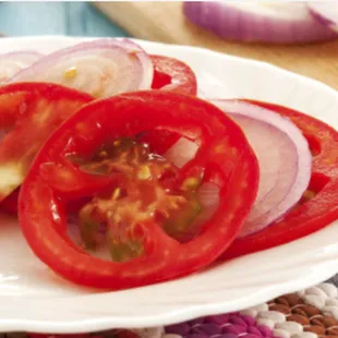 a plate of sliced tomatoes