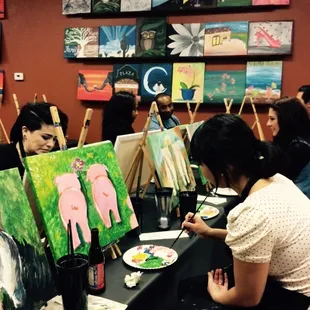 People working on their paintings