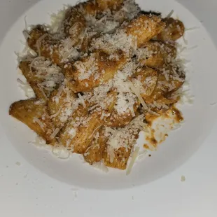 a plate of pasta with parmesan cheese