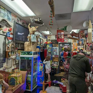 a man and a child in a toy store