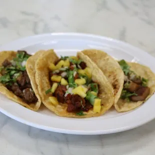 three tacos on a plate