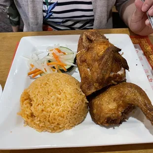 Com ga. Rice is flavorful. Chicken is crispy hot juicy.