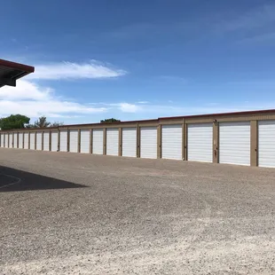 Enclosed RV Units with garage door openers and coded keypads for each.