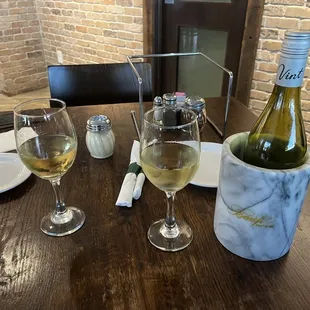 a bottle of wine and two glasses of wine