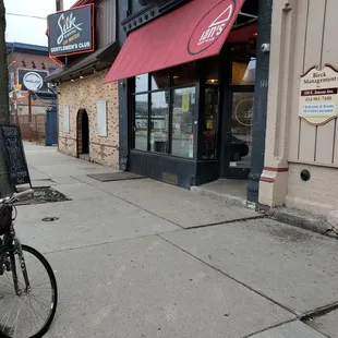 a bicycle parked on the sidewalk