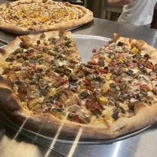 two pizzas on a table