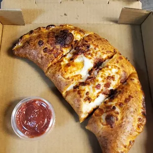 Personal size calzones topped with bacon or jalapenos