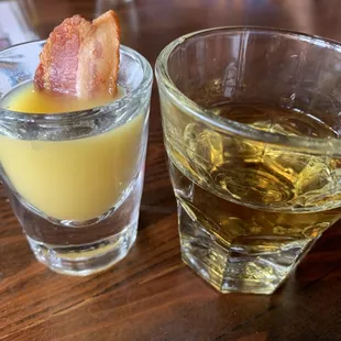 two glasses of alcohol and bacon