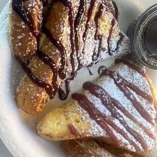 TEXAS FRENCH TOAST DRIZZLED WITH GODIVA CHOCOLATE AND DUSTED WITH POWDERED SUGAR