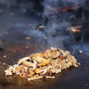 a piece of food being cooked on a grill
