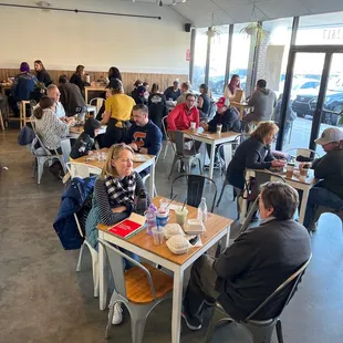a large group of people sitting at tables
