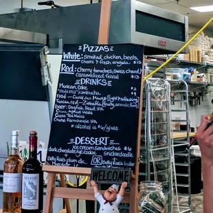 Two pizzas for Tuesday night pizza. One red, one white. Get there early, the lines were long and all pies were gone by 645.