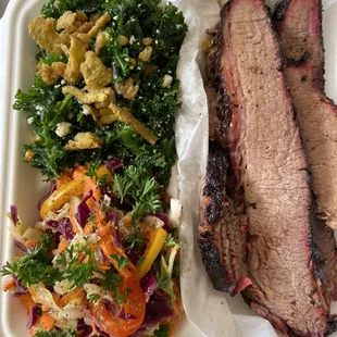 Brisket plate with smoked corn &amp; kale salad and delta slaw.