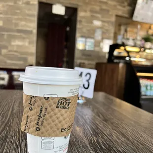 a coffee cup on a table
