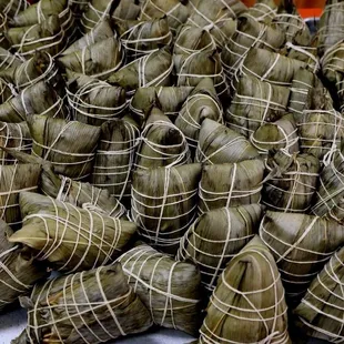 So many handmade Zongzi (Chinese tamale) freshly steamed for over 5 hours.