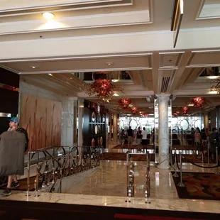 people standing in the lobby of a hotel