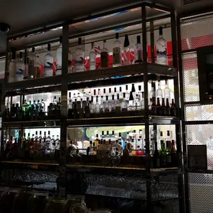 a variety of liquor bottles on shelves