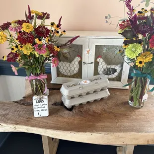 Flowers and eggs for sale