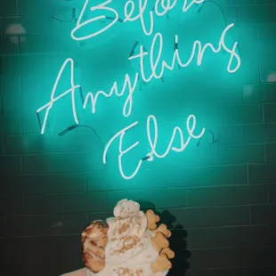 a hand holding a cup of ice cream