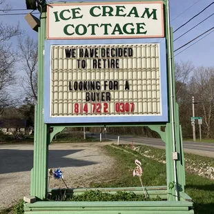 a sign for ice cream cottage
