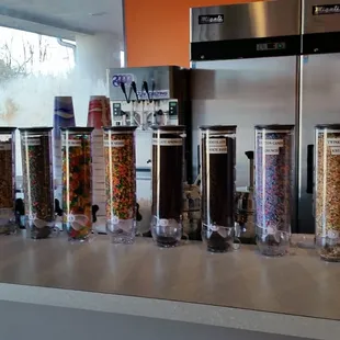 a row of candy dispensers