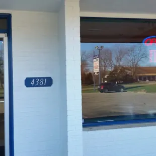 the reflection of a man in the window