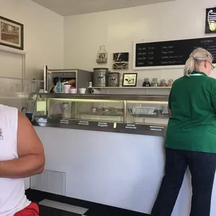 a woman standing in front of the counter