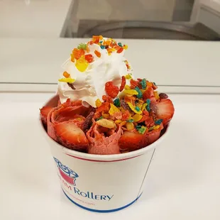 Strawberry ice cream, fruity pebbles, strawberry syrup, and whipped cream!!