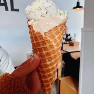 Single Split Scoop of Roasted Banana + Almond Poppyseed in a Waffle Cone