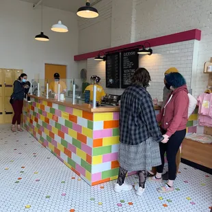 people standing at a counter