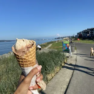 Valhalla coffee and Rocky Road scoops in a waffle cone