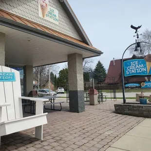a white chair and a sign