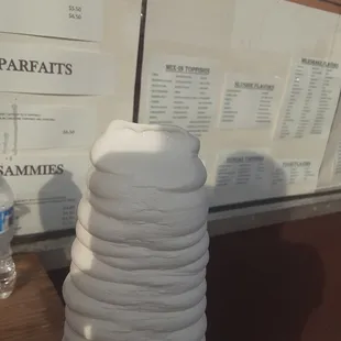 a stack of white plates