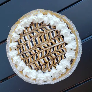 a chocolate pie with whipped cream