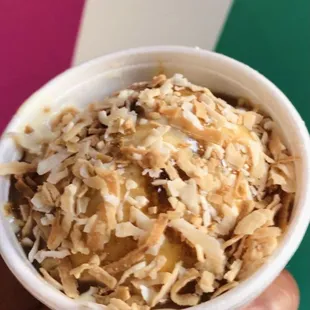Cookie butter ice cream with salted caramel syrup and toasted coconut