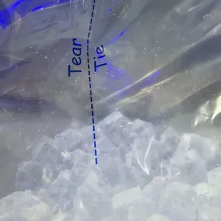 Tear at the markings and tie the ends together