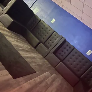 a row of black and grey couches