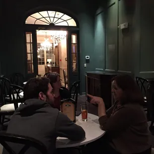 a group of people sitting around a table