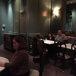 people sitting at tables with drinks