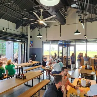 a large group of people eating and drinking