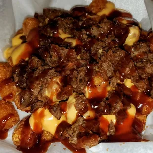 Country Tots (tots, queso, pulled pork, BBQ sauce)