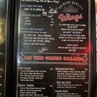 the menu for wings on the green salads